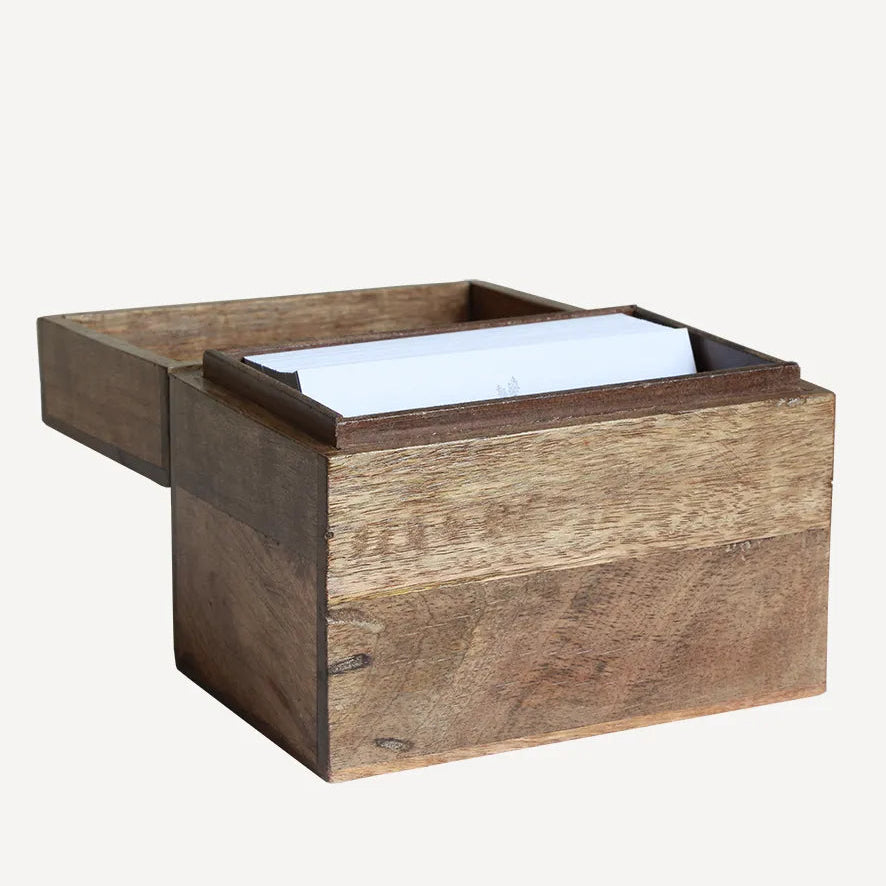 Wooden tissue box with a white tissue on a white background
