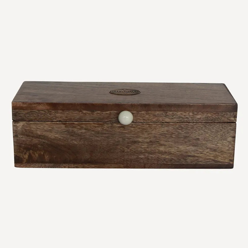 Wooden box with a white knob on a white background