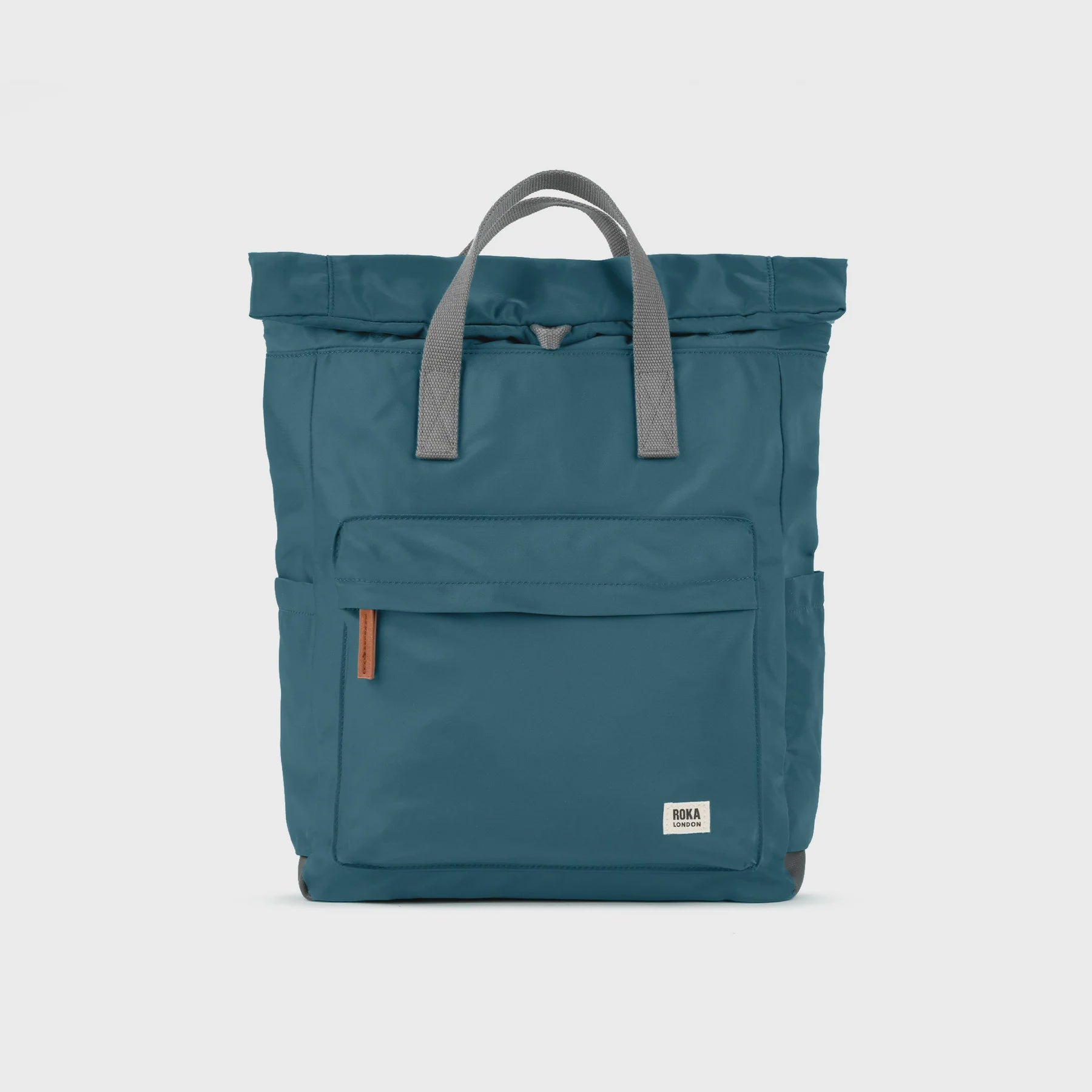 Teal backpack with gray straps on a light gray background