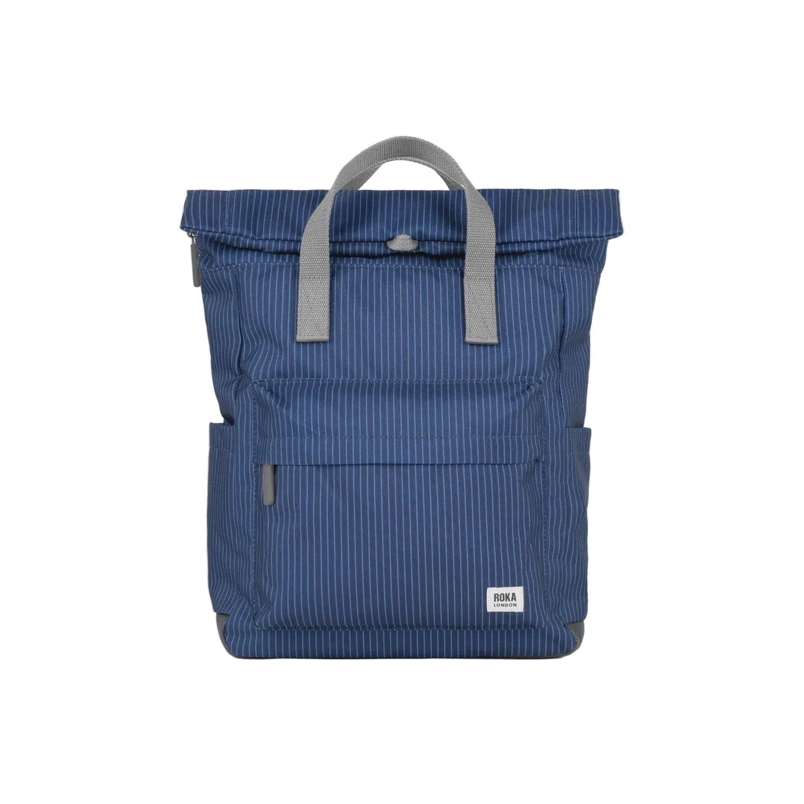 Blue backpack with gray handle on a light gray background