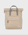 Beige backpack with gray straps on a white background