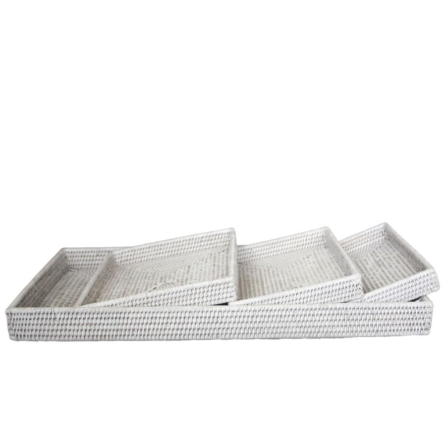Set of three woven trays on a white background
