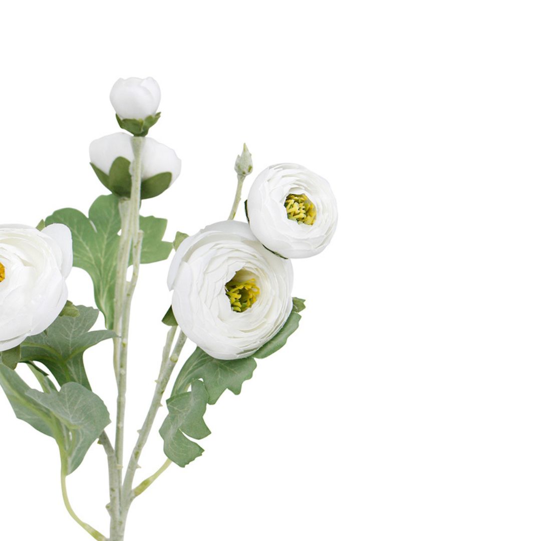 Artificial flower arrangement with white flowers and green leaves on a white background