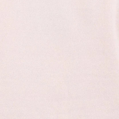 A close-up of a light cream or off-white textured fabric surface.