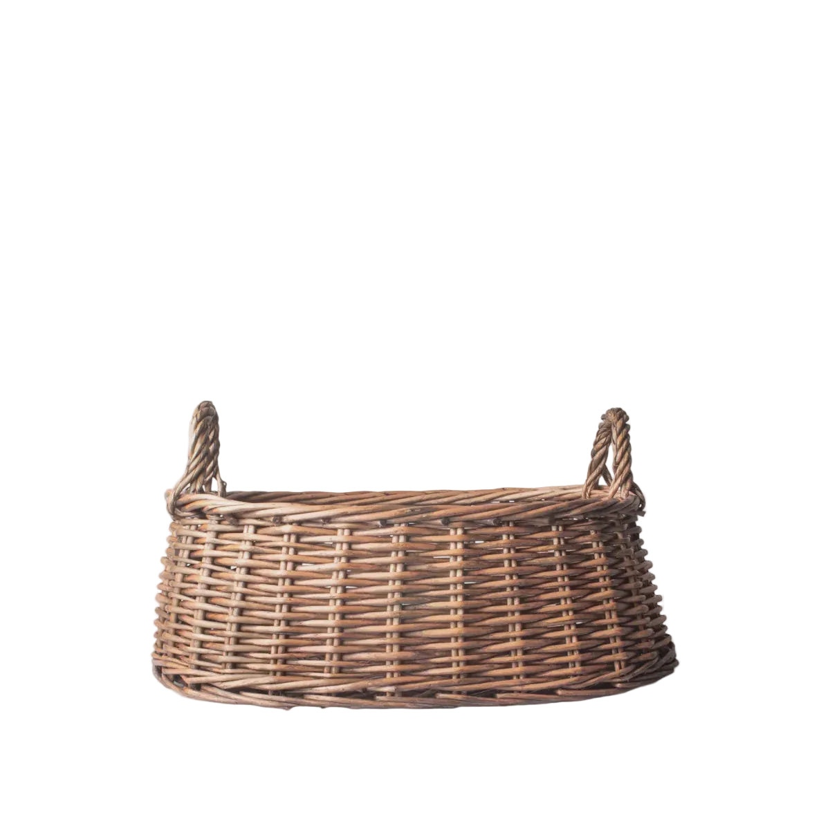 Wicker basket with handles on a light gray background