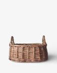 Wicker basket with handles on a white background
