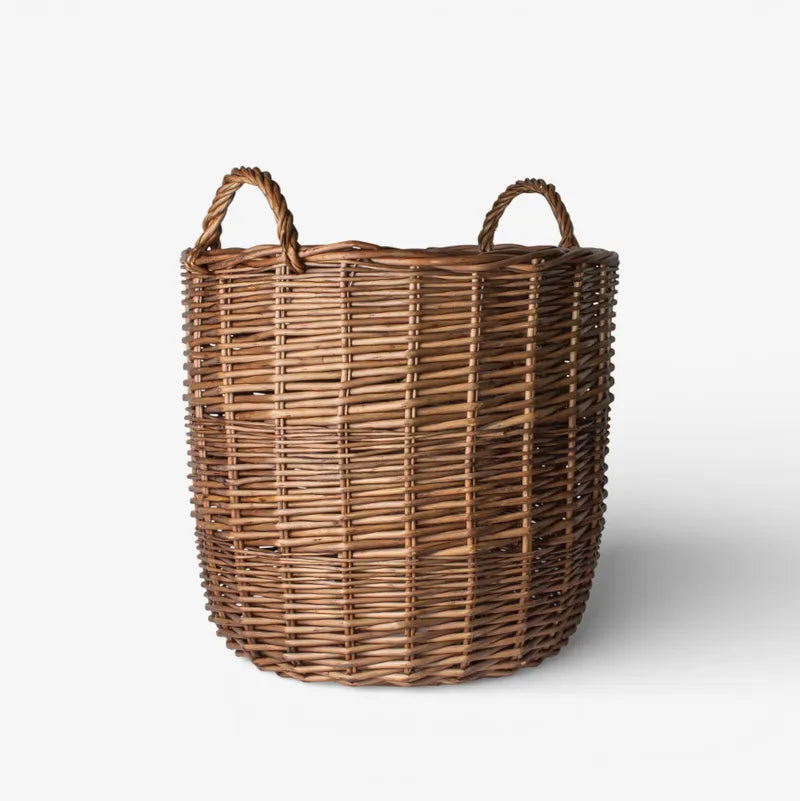 Wicker laundry basket on a white background