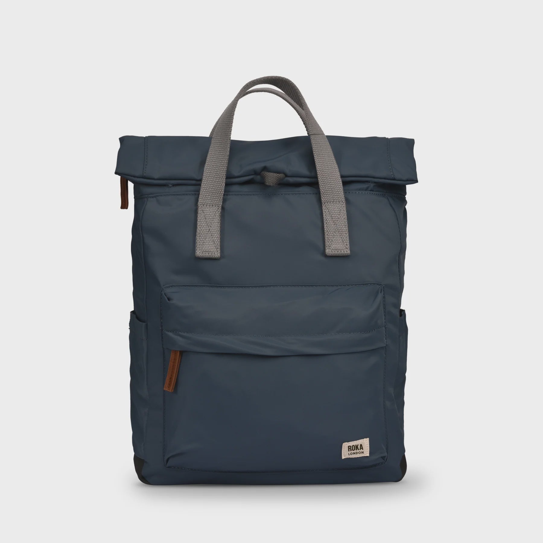 Navy blue backpack with gray straps on a light gray background