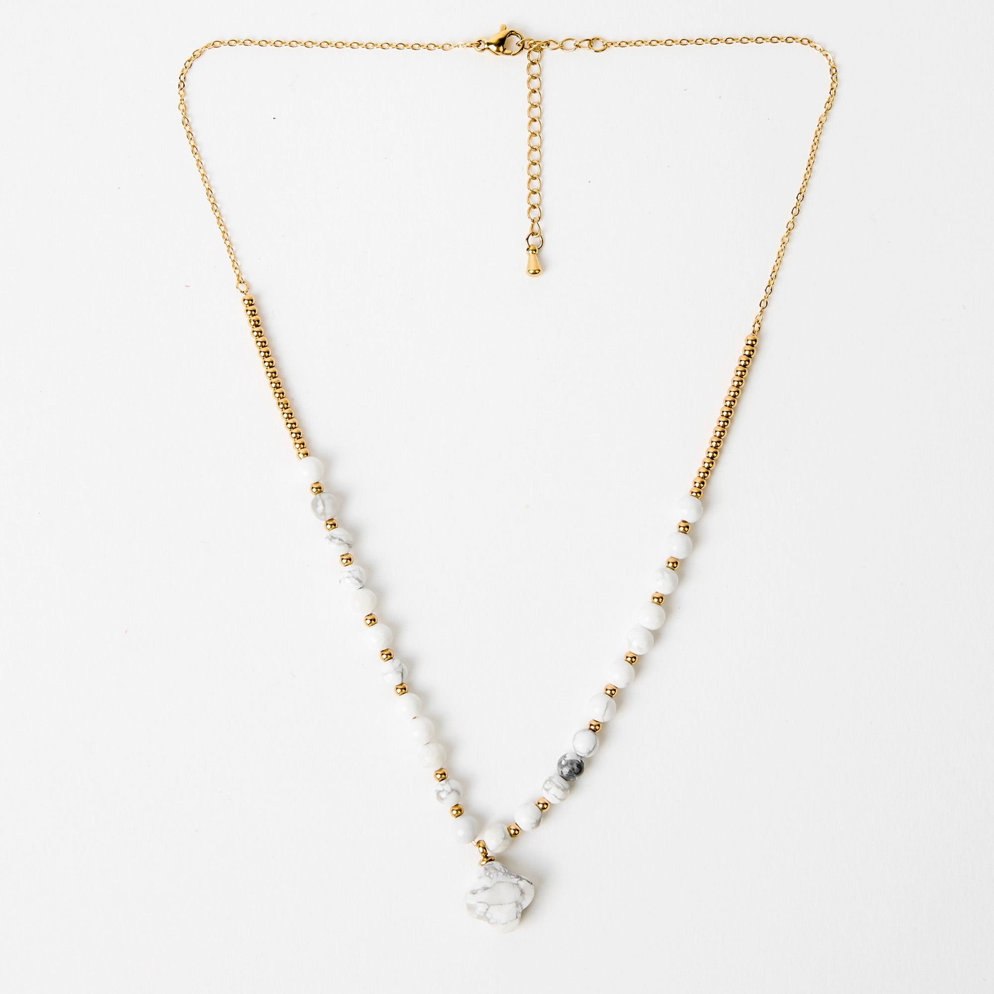 Necklace with gold chain and beads on a white background