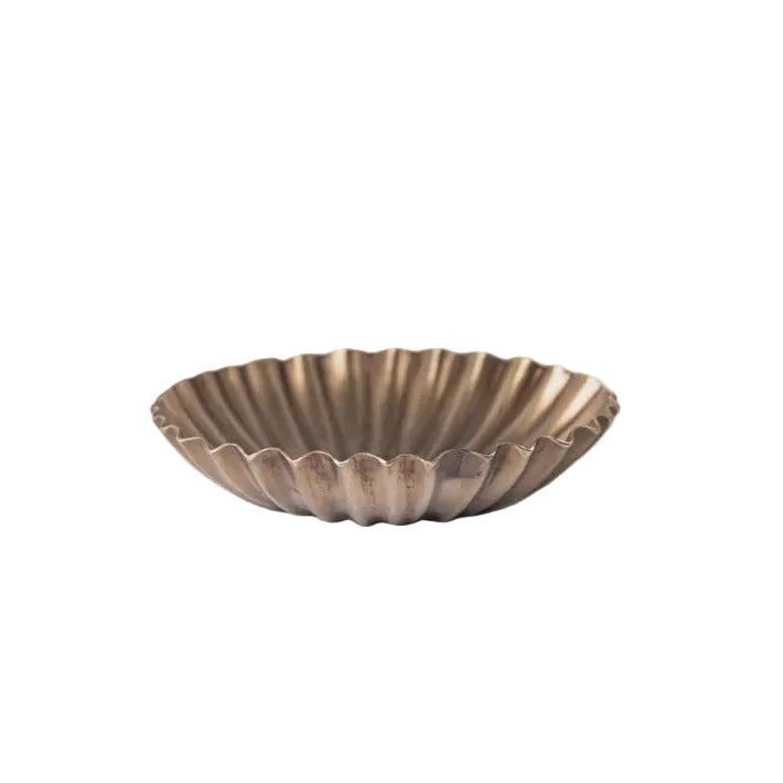 Bronze decorative bowl on a light gray background