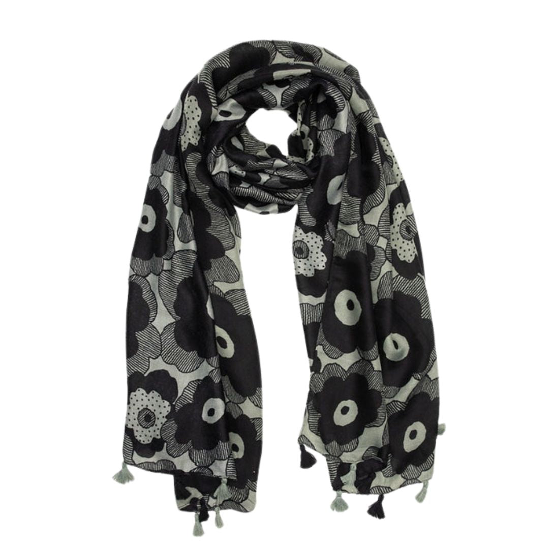 Black and white patterned scarf with tassels on a white background