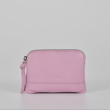 Pink wallet with a strap on a light gray background