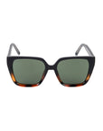 Sunglasses with tortoiseshell frame and dark lenses on a white background