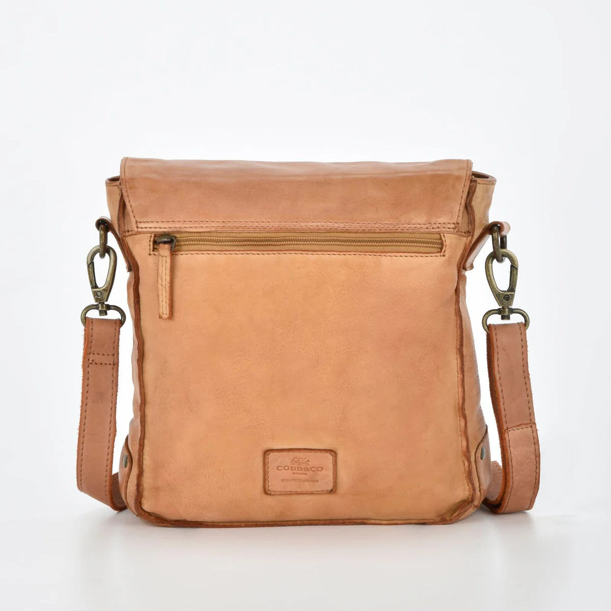 Brown leather crossbody bag on a white background