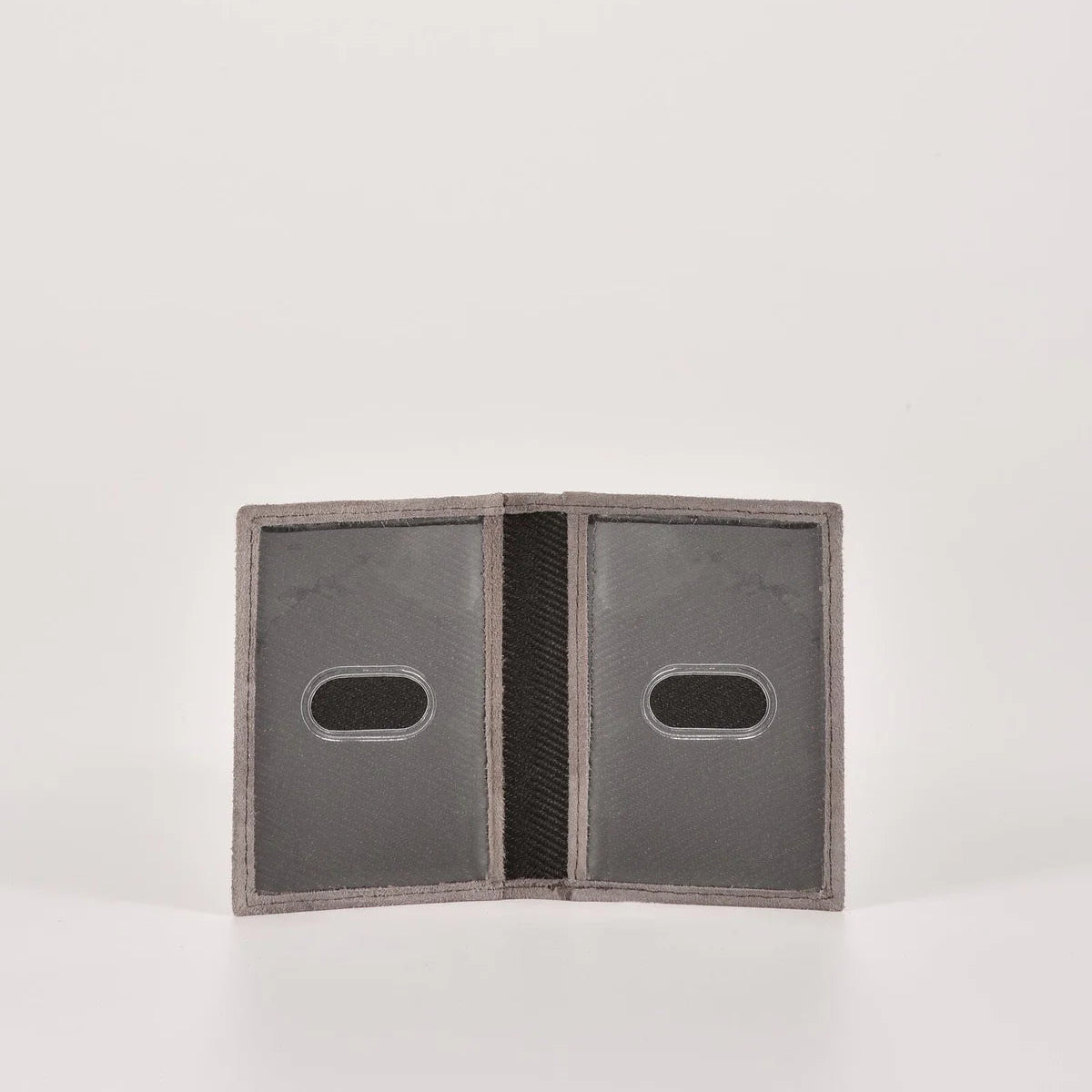 Open leather wallet with two card slots on a white background