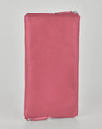 Pink wallet with a visible brand logo on a light gray background