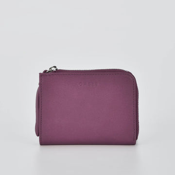Purple wallet with a brand logo on a light gray background