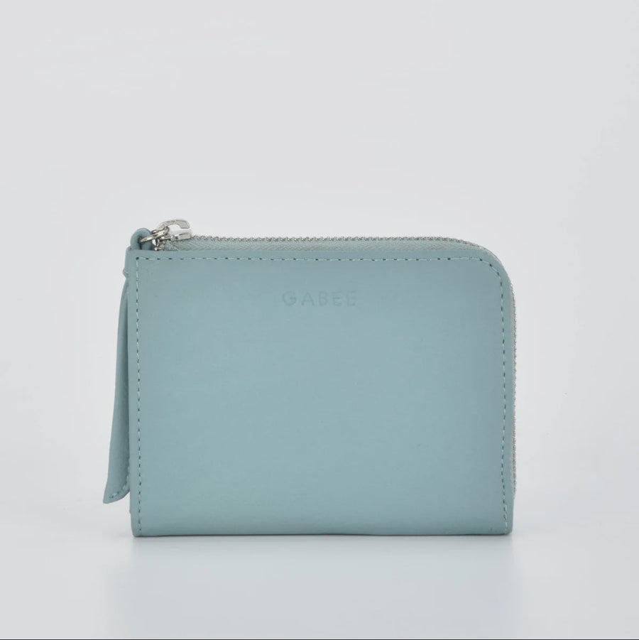 Light blue wallet with a zipper on a light gray background