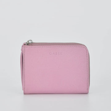 Pink wallet with 'GABEE' branding on a light gray background