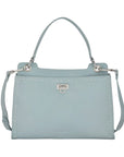 Light blue handbag with a strap on a light gray background