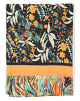 Multicolored floral and leaf patterned fabric with orange border