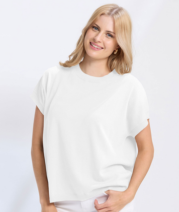 Woman wearing a white t-shirt and pants on a white background