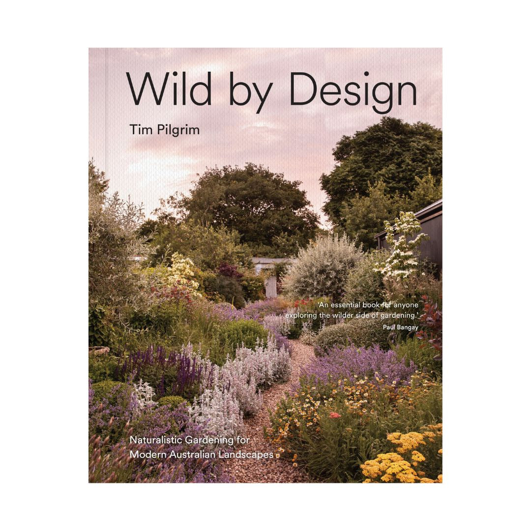 Book cover of 'Wild by Design' with a garden scene and title text.
